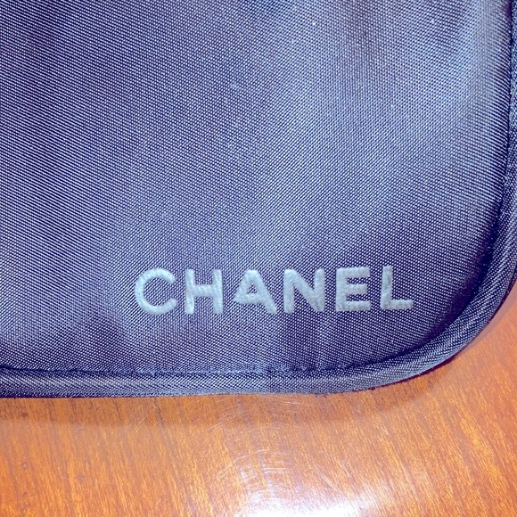 CHANEL TOILETRIES BAG. BLACK. CHANEL PRINTED IN RAISED LETTERS. HAS HANDLE. EUC - Picture 3 of 10